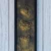 Three textured golden hearts are vertically aligned in a heart painting. The swirling patterns convey a sense of warmth and elegance.