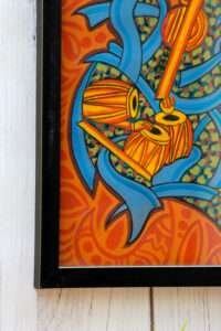 Vibrant artwork featuring yellow drums and abstract blue swirls on an orange background with black frame. The energetic design evokes rhythm and music.