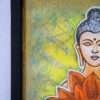 Framed painting of Buddha's serene face with closed eyes, next to a vibrant orange lotus. Background is a textured blend of green and yellow hues.