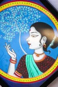 Painting of a woman with a serene expression, adorned in traditional jewelry and clothing, set against a vibrant blue background with an ornate tree.
