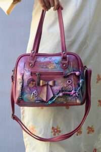 Pink sling bag with artistic texture painting and Buy handmade purses online on Artdom india